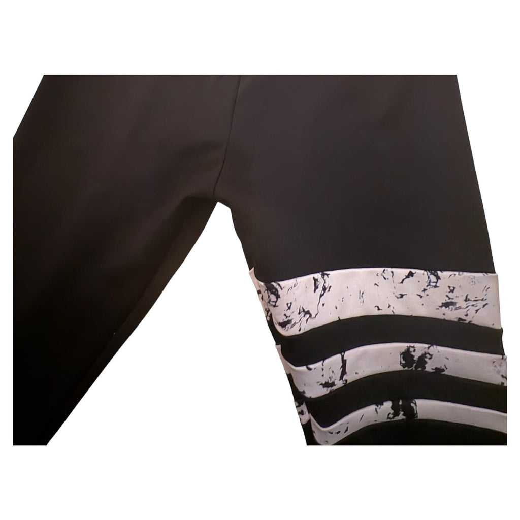 Mallas gym  talla L negras con rayas blancas 6.49€ SIN ESTRENAR