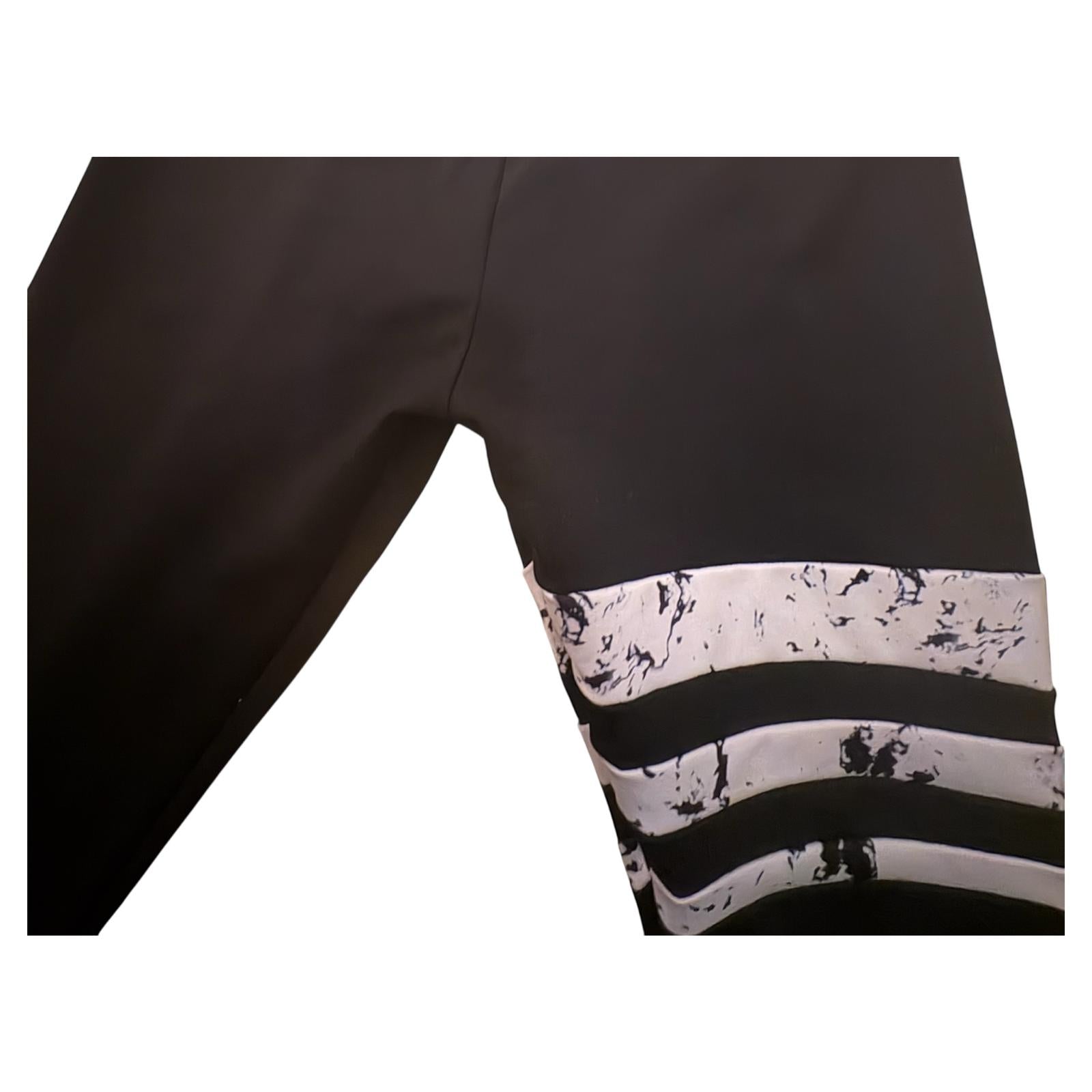 Mallas gym  talla L negras con rayas blancas 6.49€